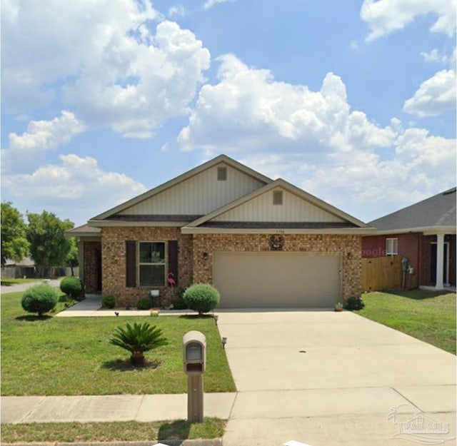 view of front of property with a front lawn and a garage