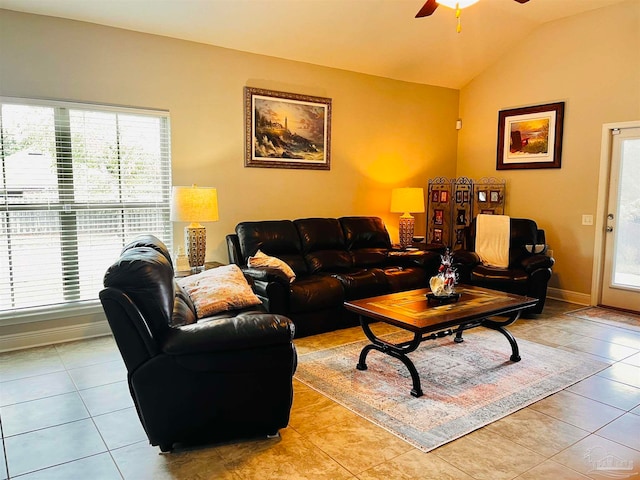 tiled living room featuring lofted ceiling and ceiling fan