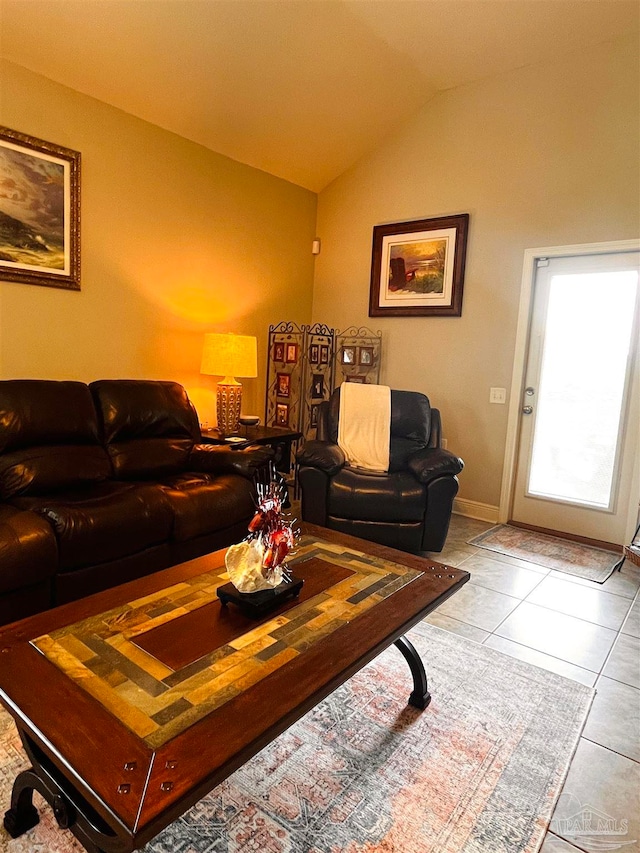 tiled living room featuring lofted ceiling