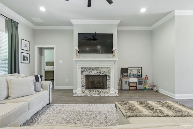 1567 Sawyers Ridge Cv, Cantonment, FL 32533 - living room with a ceiling fan, wood finished floors, ornamental molding, a premium fireplace, and recessed lighting