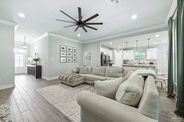 1567 Sawyers Ridge Cv, Cantonment, FL 32533 - living room with a ceiling fan, crown molding, recessed lighting, and wood finished floors