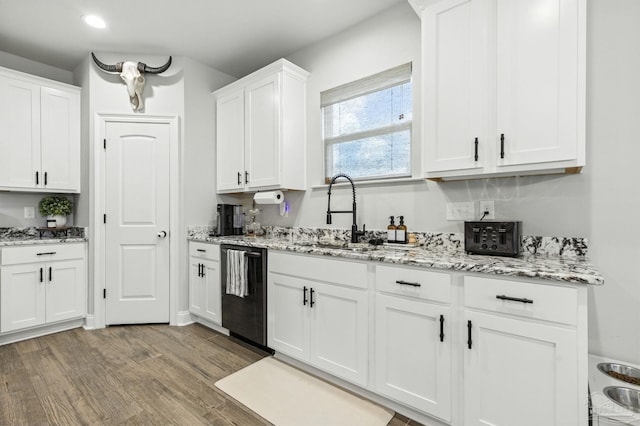 1567 Sawyers Ridge Cv, Cantonment, FL 32533 - kitchen with dishwasher, light wood-type flooring, white cabinetry, light stone countertops, and recessed lighting