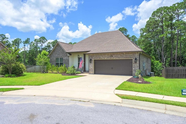 1567 Sawyers Ridge Cv, Cantonment, FL 32533 - view of front facade featuring brick siding, a garage, driveway, and roof with shingles