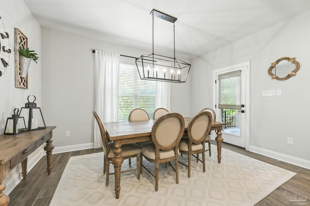1567 Sawyers Ridge Cv, Cantonment, FL 32533 - dining area featuring dark wood-style flooring and a chandelier