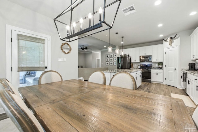 1567 Sawyers Ridge Cv, Cantonment, FL 32533 - dining area with recessed lighting, wood finished floors, and a ceiling fan