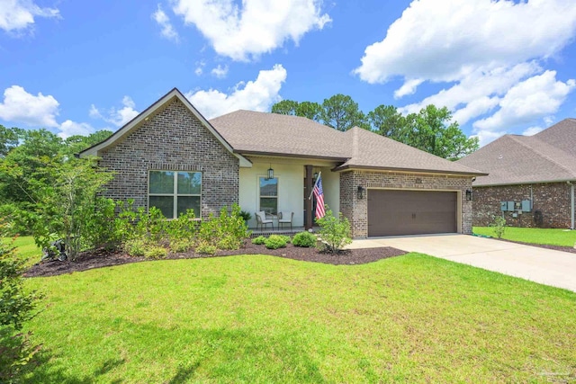 1567 Sawyers Ridge Cv, Cantonment, FL 32533 - view of front facade with brick siding, a garage, concrete driveway, and a front lawn