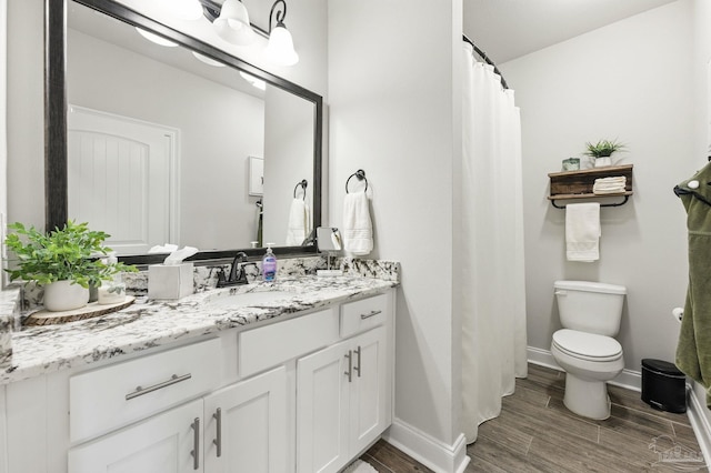 1567 Sawyers Ridge Cv, Cantonment, FL 32533 - bathroom with vanity, wood finished floors, and a shower with curtain
