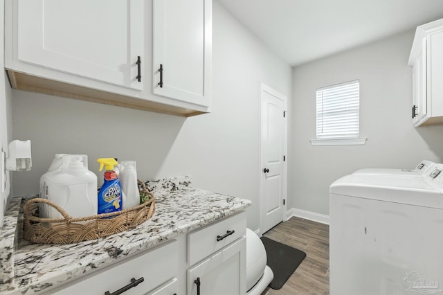 1567 Sawyers Ridge Cv, Cantonment, FL 32533 - laundry room with cabinet space, independent washer and dryer, and wood finished floors