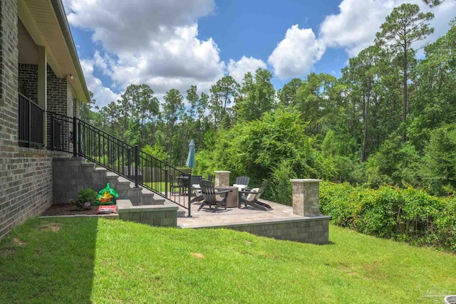1567 Sawyers Ridge Cv, Cantonment, FL 32533 - view of green lawn featuring stairs and a patio area