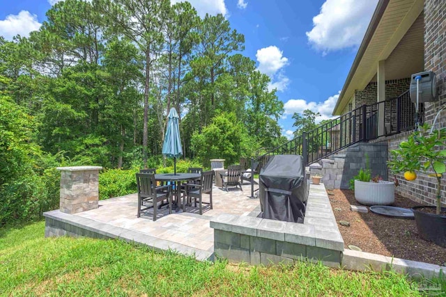 1567 Sawyers Ridge Cv, Cantonment, FL 32533 - view of patio featuring stairway, a grill, and an outdoor fire pit