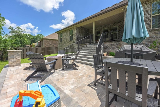 1567 Sawyers Ridge Cv, Cantonment, FL 32533 - view of patio / terrace featuring an outdoor fire pit, outdoor dining space, stairs, and grilling area