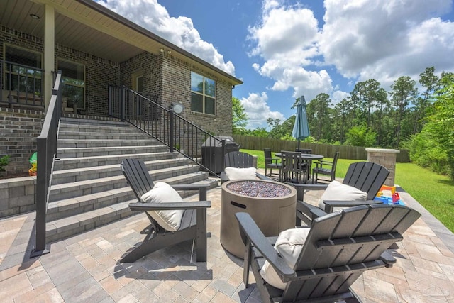 1567 Sawyers Ridge Cv, Cantonment, FL 32533 - view of patio / terrace featuring stairs, outdoor dining area, an outdoor fire pit, and a grill