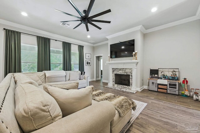 1567 Sawyers Ridge Cv, Cantonment, FL 32533 - living room featuring a ceiling fan, wood finished floors, a premium fireplace, crown molding, and recessed lighting