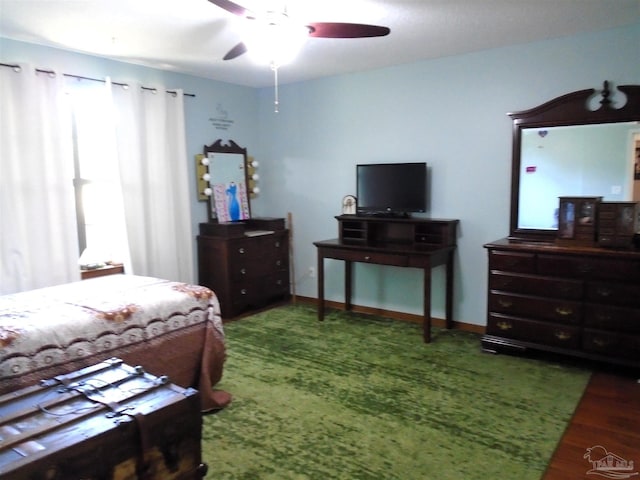 7067 Pine Blossom Rd, Milton, FL 32570 - bedroom with wood finished floors and a ceiling fan