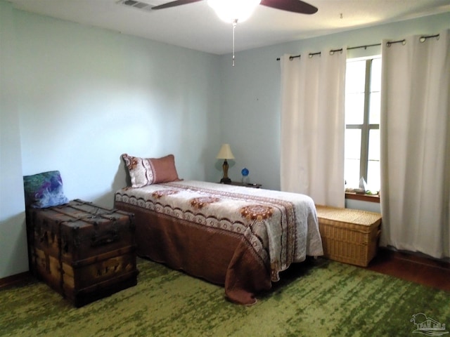 7067 Pine Blossom Rd, Milton, FL 32570 - bedroom featuring wood finished floors and ceiling fan