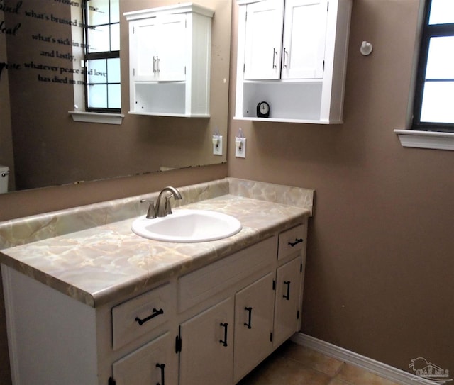 7067 Pine Blossom Rd, Milton, FL 32570 - bathroom with vanity and tile patterned flooring