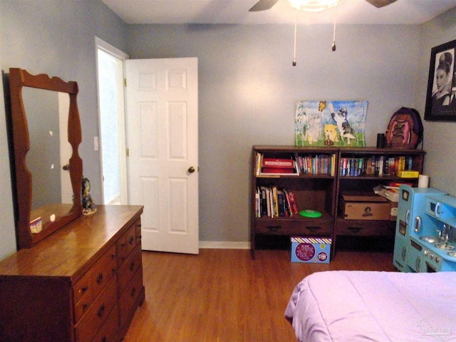7067 Pine Blossom Rd, Milton, FL 32570 - bedroom with wood finished floors and a ceiling fan