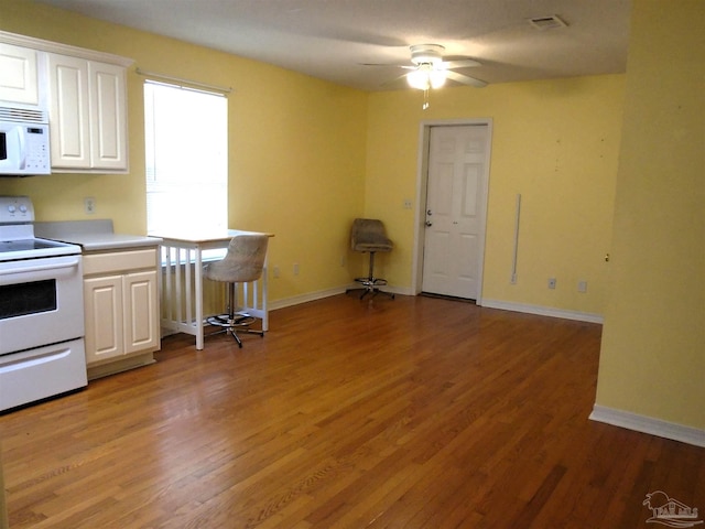 7067 Pine Blossom Rd, Milton, FL 32570 - kitchen featuring white appliances, white cabinets, a ceiling fan, and light wood finished floors