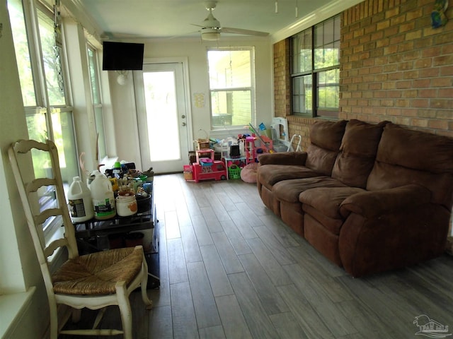 7067 Pine Blossom Rd, Milton, FL 32570 - sunroom / solarium featuring wood finished floors and brick wall