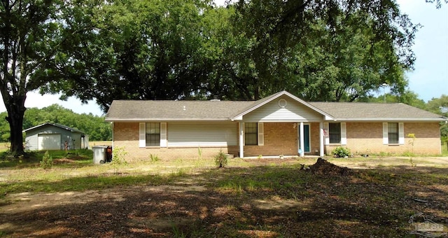 7067 Pine Blossom Rd, Milton, FL 32570 - view of front of property featuring brick siding, a porch, and a garage