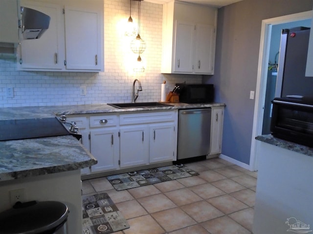 7067 Pine Blossom Rd, Milton, FL 32570 - kitchen featuring stainless steel dishwasher, white cabinetry, backsplash, and black microwave