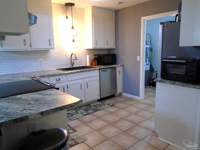 7067 Pine Blossom Rd, Milton, FL 32570 - kitchen with dishwasher, white cabinets, decorative backsplash, and black microwave