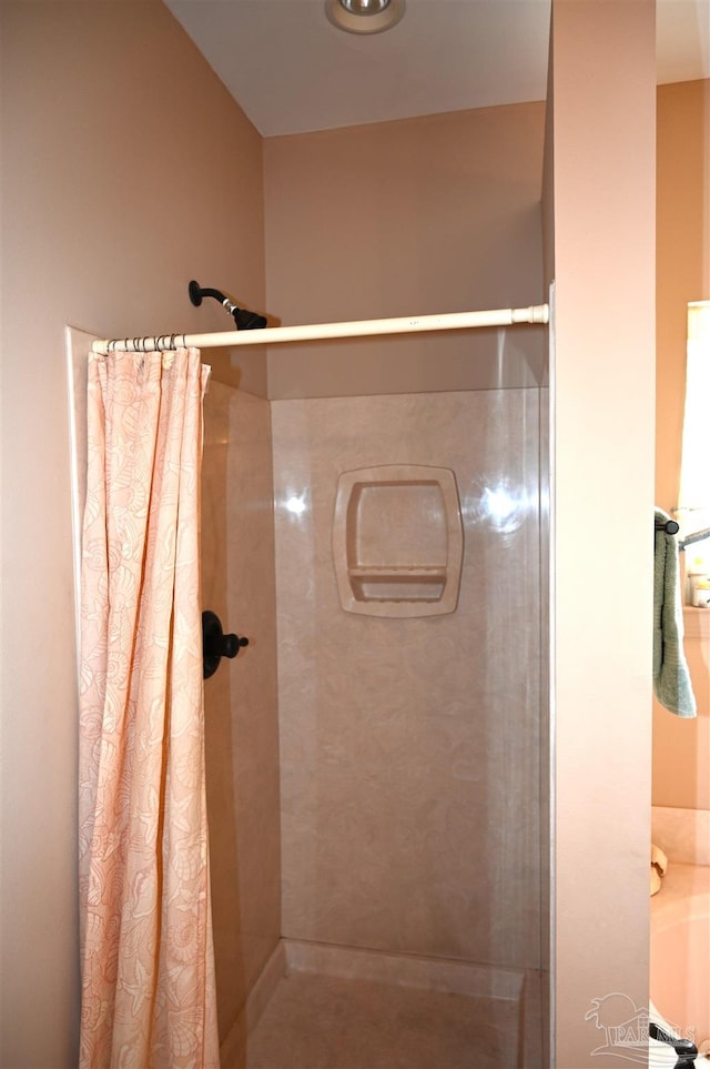 bathroom with a shower with curtain