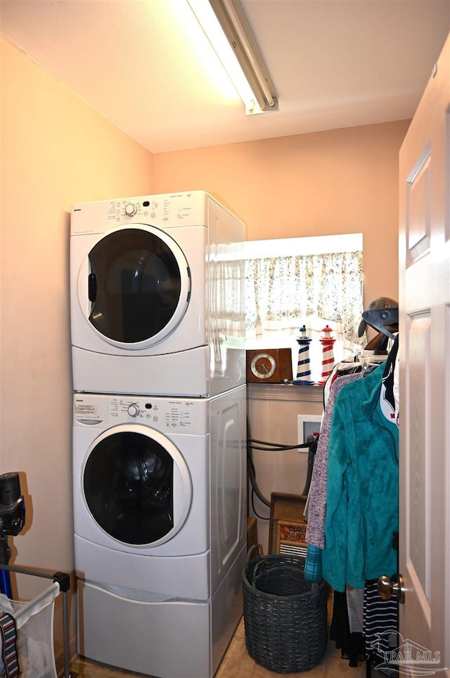 laundry room with stacked washer and dryer