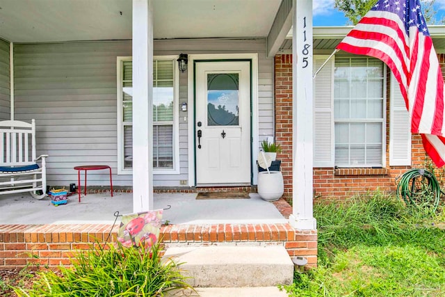 entrance to property featuring covered porch