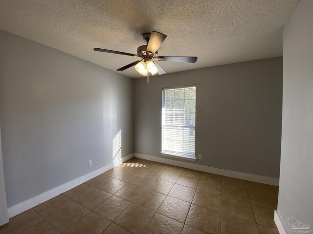 bathroom featuring a skylight, a shower with shower curtain, vanity, ornamental molding, and tile patterned flooring