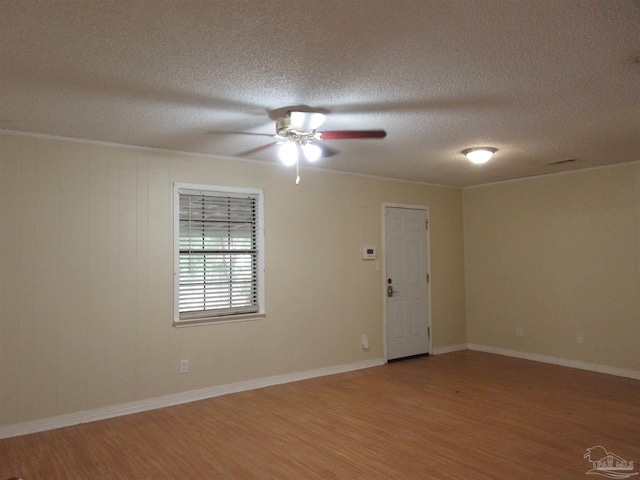 5078 Babb Ln, Pace, FL 32571 - empty room with light wood-type flooring, ceiling fan, and a textured ceiling