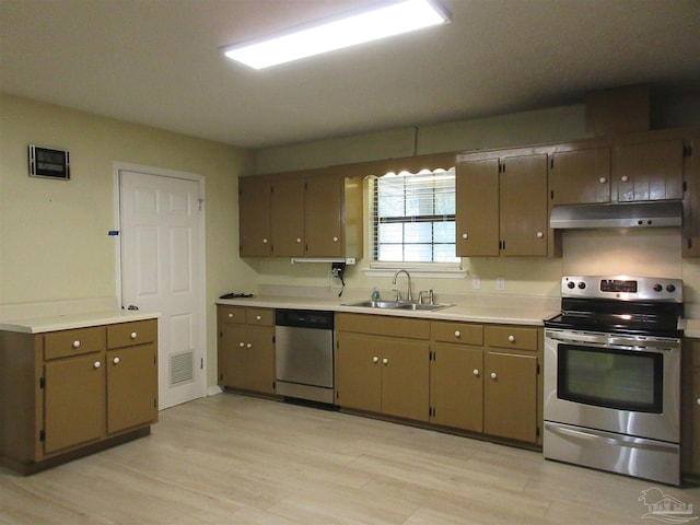 5078 Babb Ln, Pace, FL 32571 - kitchen featuring stainless steel appliances, under cabinet range hood, light wood-style floors, and light countertops