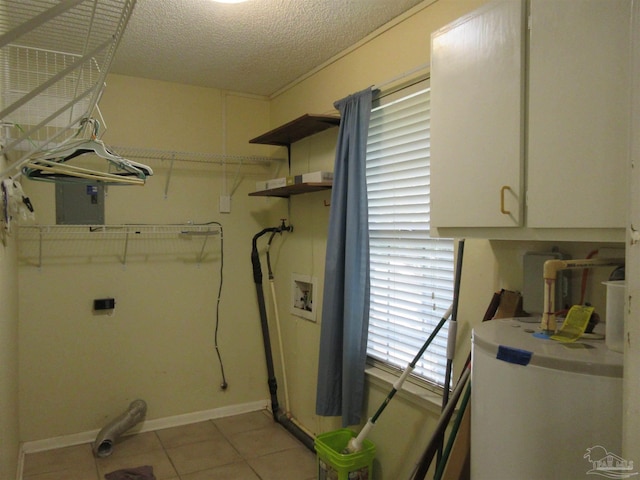 5078 Babb Ln, Pace, FL 32571 - laundry area with cabinet space, water heater, washer hookup, light tile patterned floors, and hookup for an electric dryer