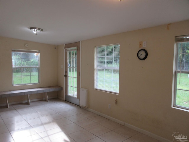5078 Babb Ln, Pace, FL 32571 - empty room with light tile patterned floors and radiator