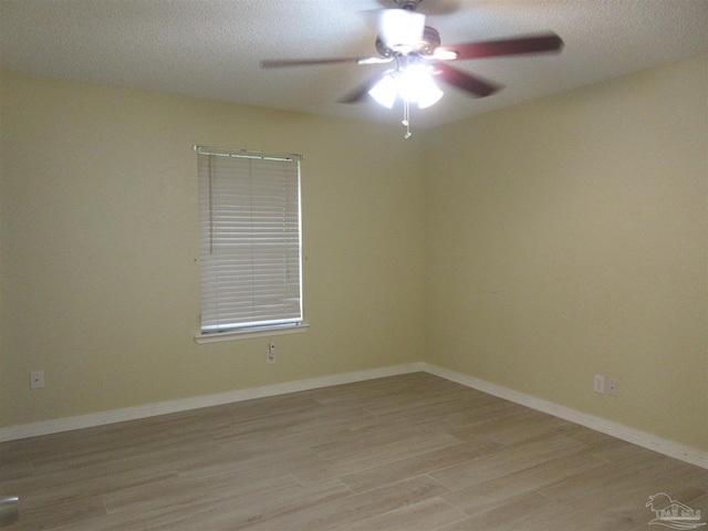 5078 Babb Ln, Pace, FL 32571 - unfurnished room with ceiling fan, light wood-type flooring, and a textured ceiling
