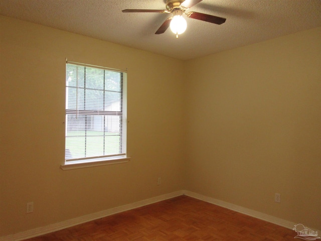 5078 Babb Ln, Pace, FL 32571 - empty room featuring a textured ceiling and a ceiling fan