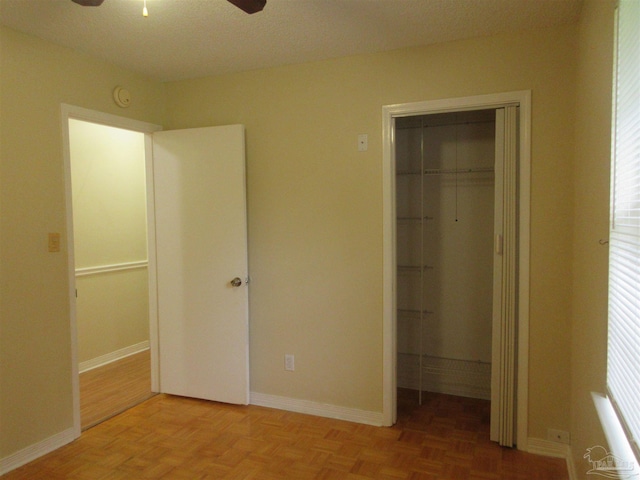5078 Babb Ln, Pace, FL 32571 - unfurnished bedroom with a closet, ceiling fan, and a walk in closet