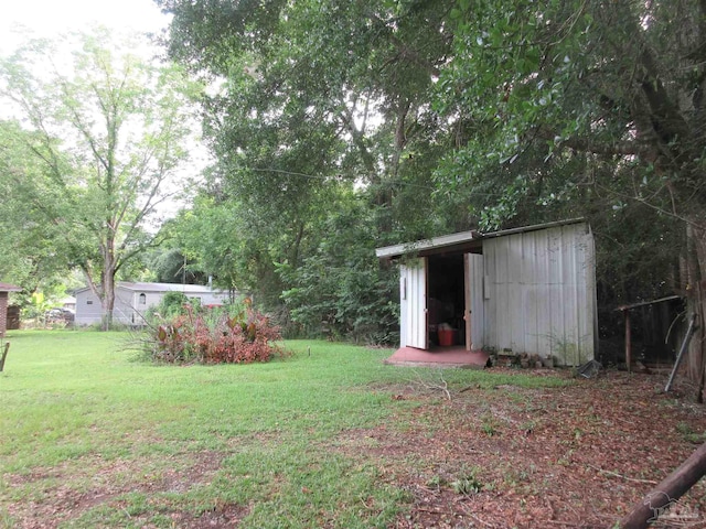 5078 Babb Ln, Pace, FL 32571 - view of green lawn featuring a shed