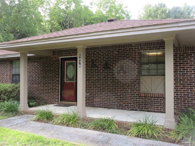 5078 Babb Ln, Pace, FL 32571 - property entrance featuring brick siding and roof with shingles