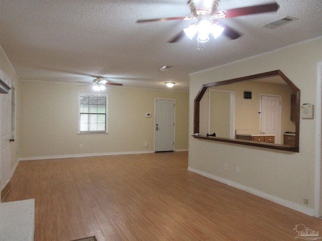 5078 Babb Ln, Pace, FL 32571 - unfurnished living room with a ceiling fan, wood finished floors, and a textured ceiling