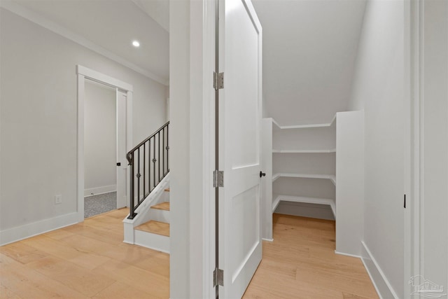 interior space with hardwood / wood-style flooring and crown molding