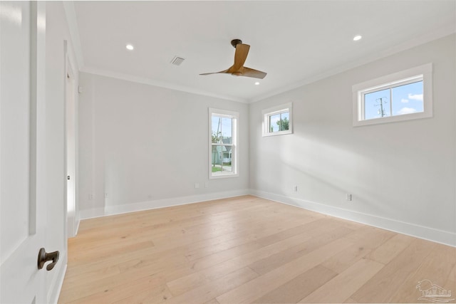 empty room with ceiling fan, ornamental molding, and light wood-type flooring