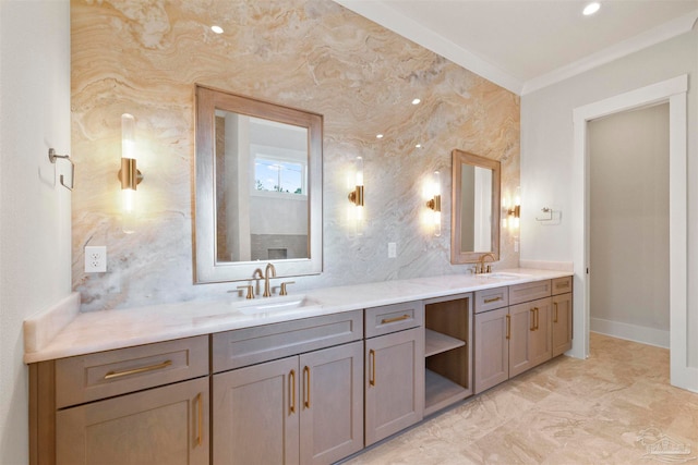 bathroom with ornamental molding and vanity