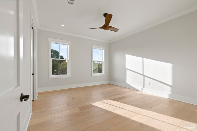 unfurnished room featuring crown molding, ceiling fan, and light hardwood / wood-style floors