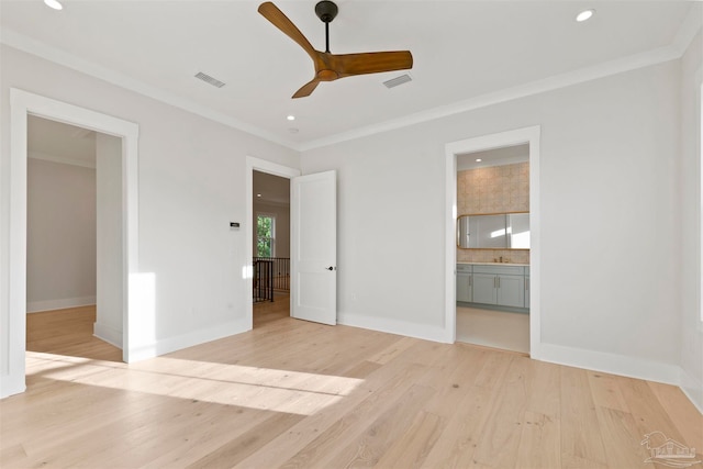 unfurnished bedroom with connected bathroom, crown molding, light hardwood / wood-style flooring, and ceiling fan