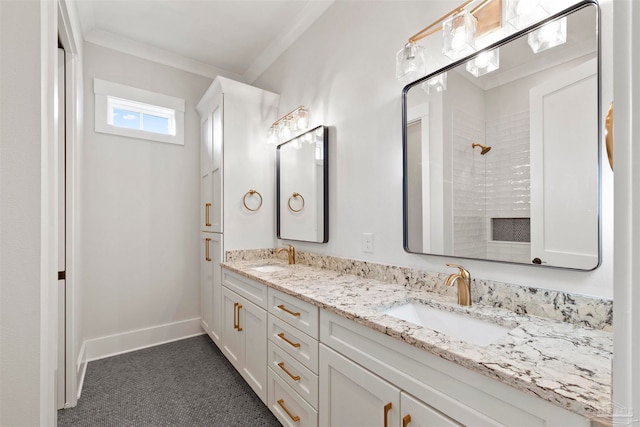 bathroom with crown molding, vanity, and a shower