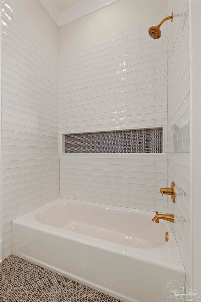 bathroom featuring tile patterned flooring and tiled shower / bath combo