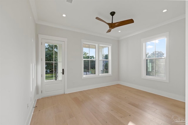 unfurnished room featuring crown molding, light hardwood / wood-style flooring, and ceiling fan