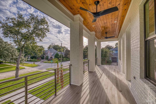 wooden deck with ceiling fan