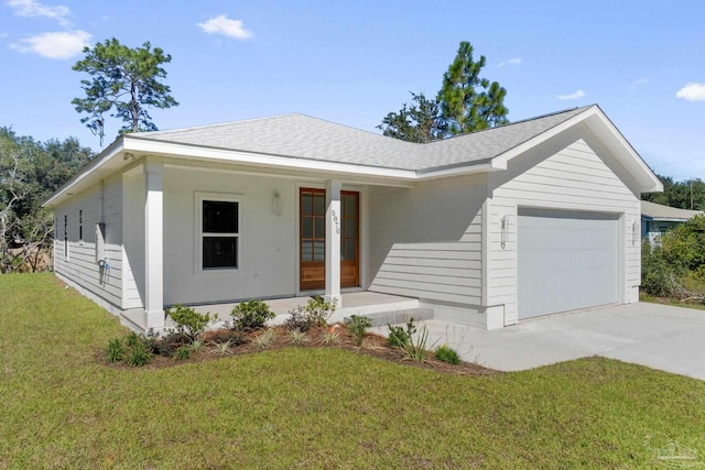 view of front facade featuring a porch, a front yard, and a garage